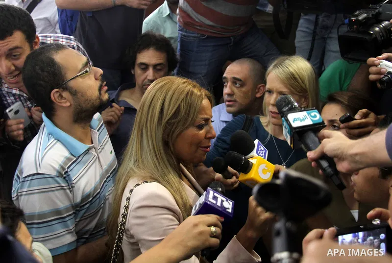 Marwa Omara, wife of Al Jazeera television journalist Mohamed Fahmy, talks to the media after the verdict at a court in Cairo, Egypt, August 29, 2015. An Egyptian court sentenced three Al Jazeera TV journalists to three...