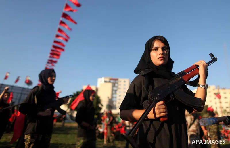 Palestinian girls participate in a military graduation ceremony of the Popular Front for the Liberation of Palestine (PFLP), in Gaza city on August 29, 2015. Photo by Ashraf Amra