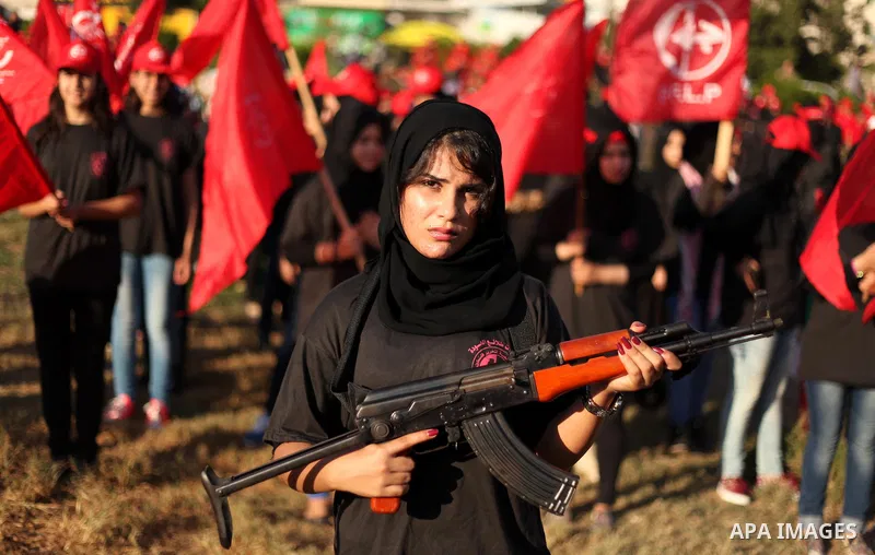 Palestinian girls participate in a military graduation ceremony of the Popular Front for the Liberation of Palestine (PFLP), in Gaza city on August 29, 2015. Photo by Ashraf Amra