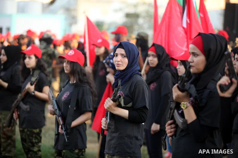 Palestinian girls participate in a military graduation ceremony of the Popular Front for the Liberation of Palestine (PFLP), in Gaza city on August 29, 2015. Photo by Ashraf Amra
