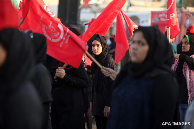 Palestinian girls participate in a military graduation ceremony of the Popular Front for the Liberation of Palestine (PFLP), in Gaza city on August 29, 2015. Photo by Ashraf Amra