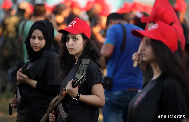 Palestinian girls participate in a military graduation ceremony of the Popular Front for the Liberation of Palestine (PFLP), in Gaza city on August 29, 2015. Photo by Ashraf Amra
