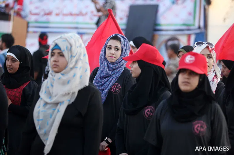 Palestinian girls participate in a military graduation ceremony of the Popular Front for the Liberation of Palestine (PFLP), in Gaza city on August 29, 2015. Photo by Ashraf Amra