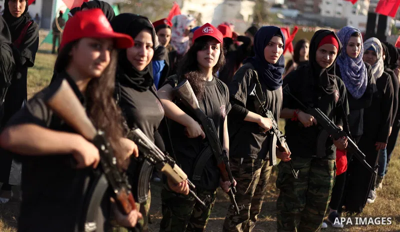 Palestinian girls participate in a military graduation ceremony of the Popular Front for the Liberation of Palestine (PFLP), in Gaza city on August 29, 2015. Photo by Ashraf Amra