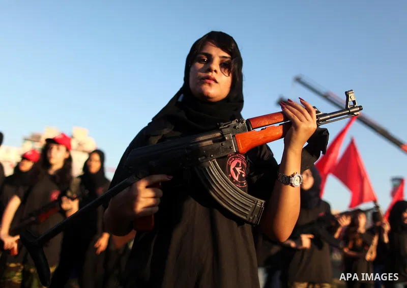 Palestinian girls participate in a military graduation ceremony of the Popular Front for the Liberation of Palestine (PFLP), in Gaza city on August 29, 2015. Photo by Ashraf Amra