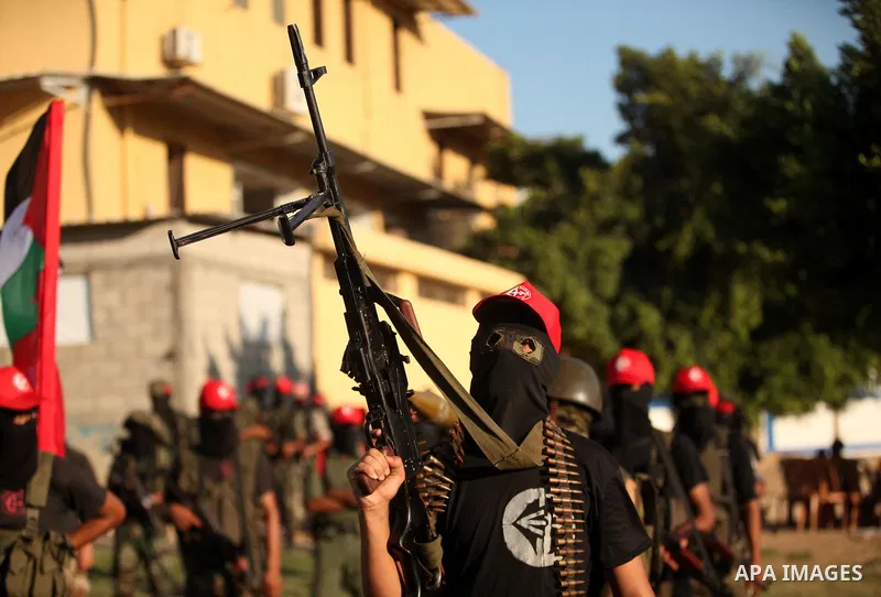 Palestinian youths participate in a military graduation ceremony of the Popular Front for the Liberation of Palestine (PFLP), in Gaza city on August 29, 2015. Photo by Ashraf Amra