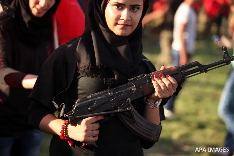 Palestinian girls participate in a military graduation ceremony of the Popular Front for the Liberation of Palestine (PFLP), in Gaza city on August 29, 2015. Photo by Ashraf Amra