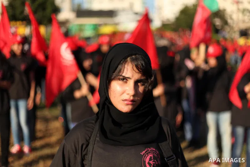 Palestinian girls participate in a military graduation ceremony of the Popular Front for the Liberation of Palestine (PFLP), in Gaza city on August 29, 2015. Photo by Ashraf Amra