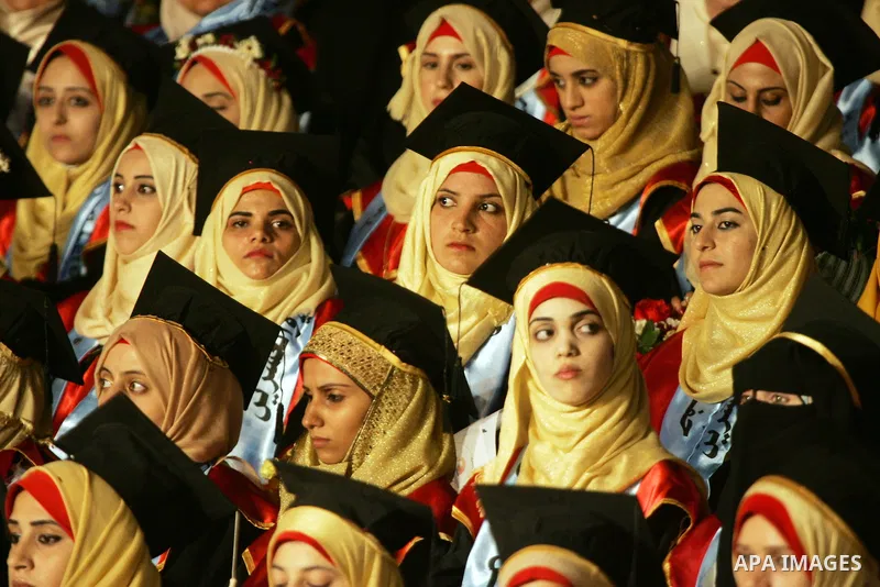 Palestinian students take part in their graduation ceremony at Al-Aqsa University in Khan Younis in the southern of Gaza strip on August 29, 2015. Photo by Abed Rahim Khatib