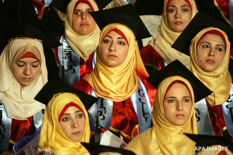 Palestinian students take part in their graduation ceremony at Al-Aqsa University in Khan Younis in the southern of Gaza strip on August 29, 2015. Photo by Abed Rahim Khatib