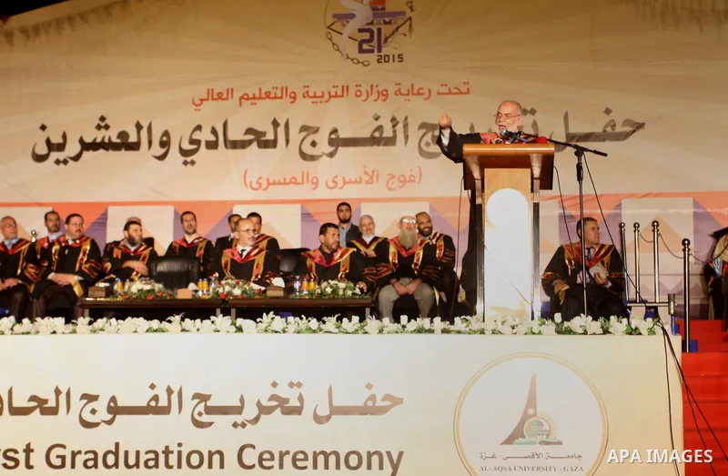 Palestinian students take part in their graduation ceremony at Al-Aqsa University in Khan Younis in the southern of Gaza strip on August 29, 2015. Photo by Abed Rahim Khatib