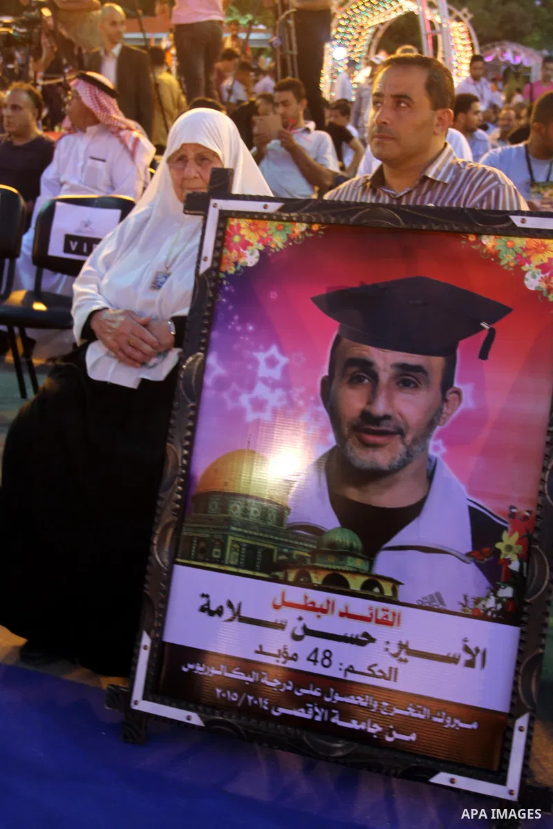 Palestinian students take part in their graduation ceremony at Al-Aqsa University in Khan Younis in the southern of Gaza strip on August 29, 2015. Photo by Abed Rahim Khatib