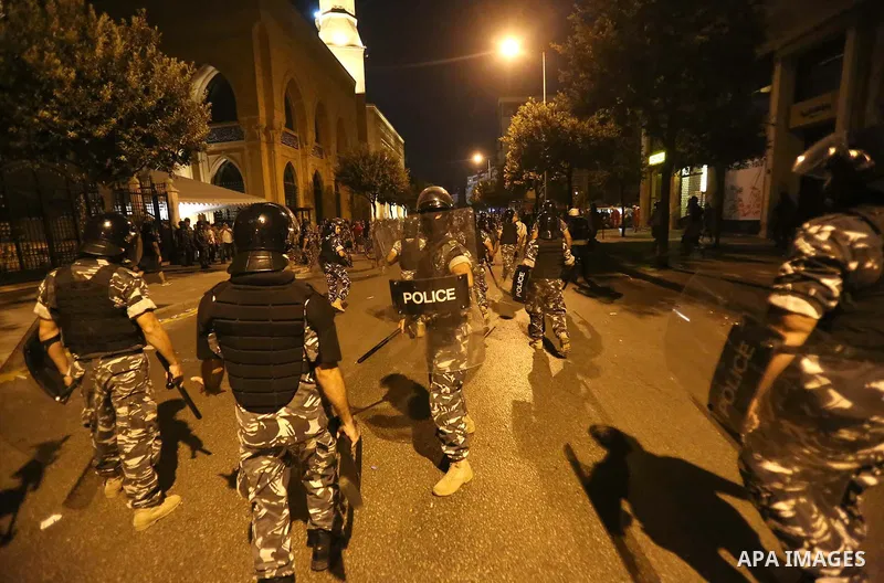 Lebanese policemen stand guard after dispersing a demonstration against the anti-government at Martyrs' Square in downtown Beirut, Lebanon August 29, 2015. Thousands of protesters waving Lebanese flags and chanting "revo...