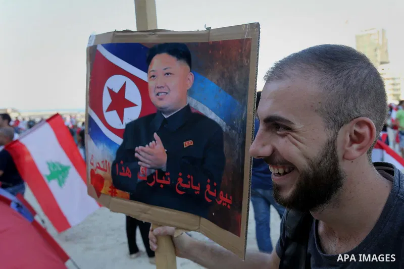 People carry Lebanese national flags and chant slogans as they take part in an anti-government protest at Martyrs' Square in downtown Beirut, Lebanon August 29, 2015. Thousands of protesters waving Lebanese flags and cha...