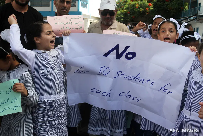 Palestinian pupils take part in a protest against the reduction of educational programs given by the United Nations Relief and Works Agency (UNRWA) and the growing number of students per class due to lack of funds in the...