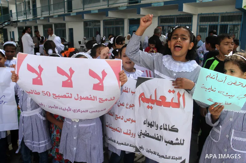 Palestinian pupils take part in a protest against the reduction of educational programs given by the United Nations Relief and Works Agency (UNRWA) and the growing number of students per class due to lack of funds in the...