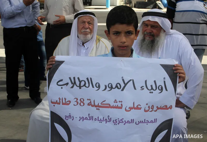 Palestinian pupils take part in a protest against the reduction of educational programs given by the United Nations Relief and Works Agency (UNRWA) and the growing number of students per class due to lack of funds in the...