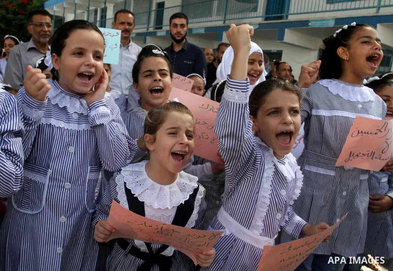 Palestinian pupils take part in a protest against the reduction of educational programs given by the United Nations Relief and Works Agency (UNRWA) and the growing number of students per class due to lack of funds in the...