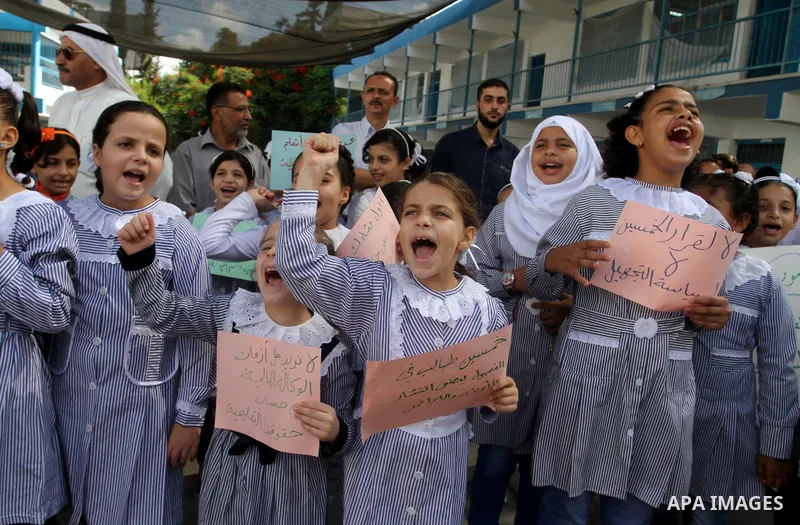 Palestinian pupils take part in a protest against the reduction of educational programs given by the United Nations Relief and Works Agency (UNRWA) and the growing number of students per class due to lack of funds in the...