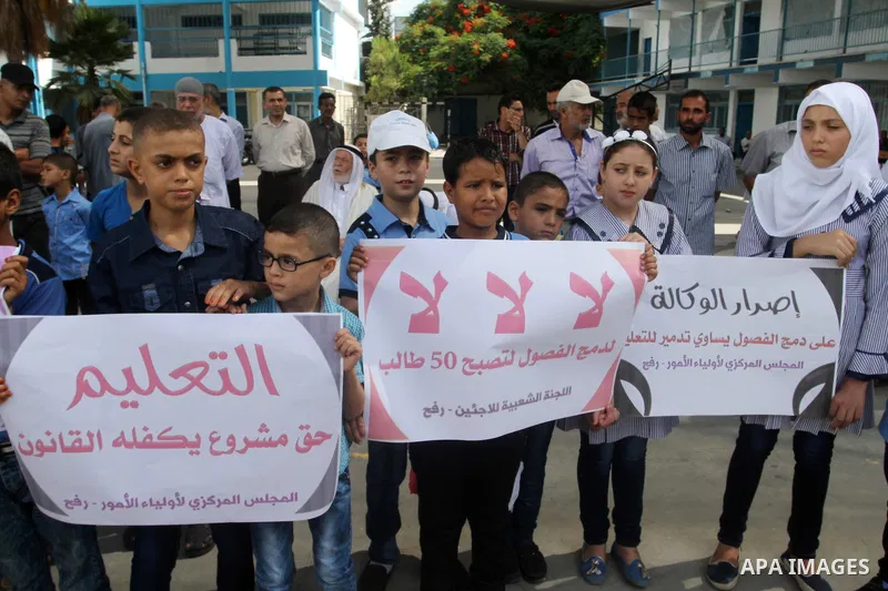 Palestinian pupils take part in a protest against the reduction of educational programs given by the United Nations Relief and Works Agency (UNRWA) and the growing number of students per class due to lack of funds in the...