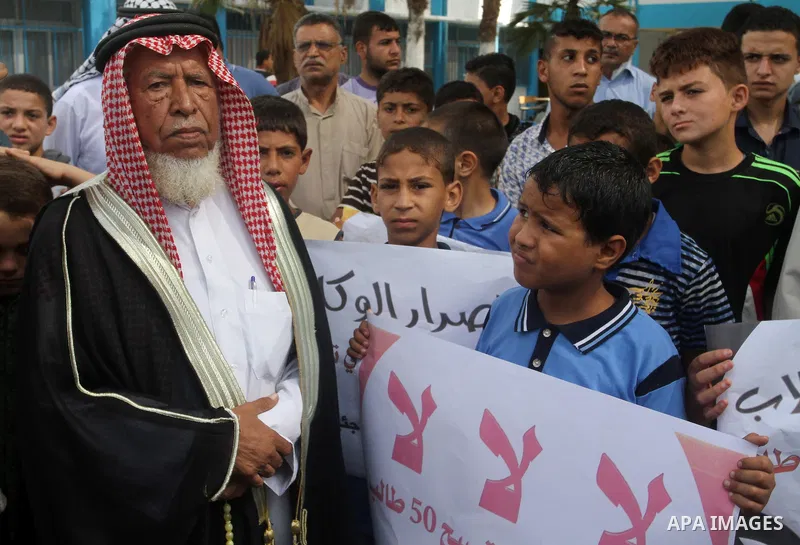 Palestinian pupils take part in a protest against the reduction of educational programs given by the United Nations Relief and Works Agency (UNRWA) and the growing number of students per class due to lack of funds in the...