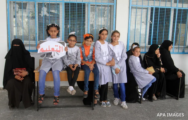 Palestinian pupils take part in a protest against the reduction of educational programs given by the United Nations Relief and Works Agency (UNRWA) and the growing number of students per class due to lack of funds in the...