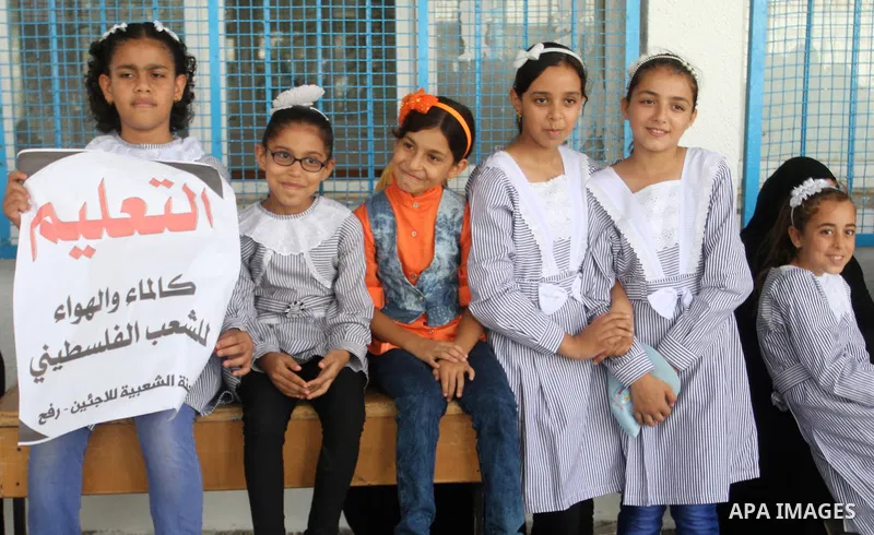 Palestinian pupils take part in a protest against the reduction of educational programs given by the United Nations Relief and Works Agency (UNRWA) and the growing number of students per class due to lack of funds in the...