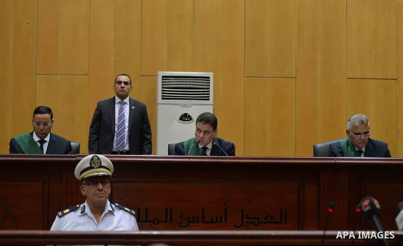 Egyptian Judge Mohammed Sheren Fahmi speaks during the trial of ousted Egyptian president Mohammed Morsi in a court in Cairo on August 27, 2015. Cairo criminal court resumes today the trial of deposed president Mohamed M...