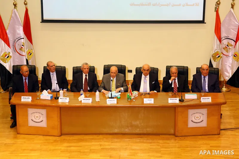 Members of the High Elections Committee attend a news conference in Cairo, Egypt, August 30, 2015. Egypt will hold a long-awaited parliamentary election in two phases starting Oct. 18-19, the election commission said on...
