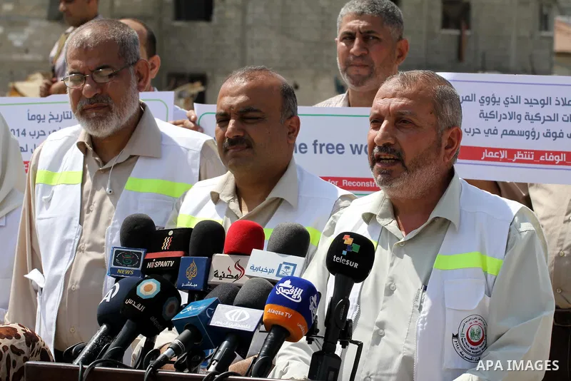 Palestinian manager of El-Wafa hospital, Tayssir El-Beltagy speaks during a press conference in front of the rubbles of El-Wafa hospital, which witnesses said was destroyed during a seven-week Israeli offensive, in the e...