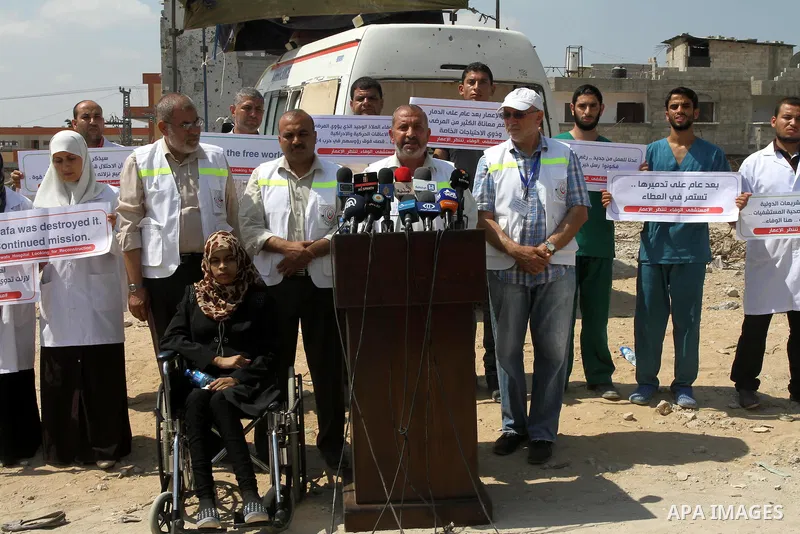 Palestinian manager of El-Wafa hospital, Tayssir El-Beltagy speaks during a press conference in front of the rubbles of El-Wafa hospital, which witnesses said was destroyed during a seven-week Israeli offensive, in the e...