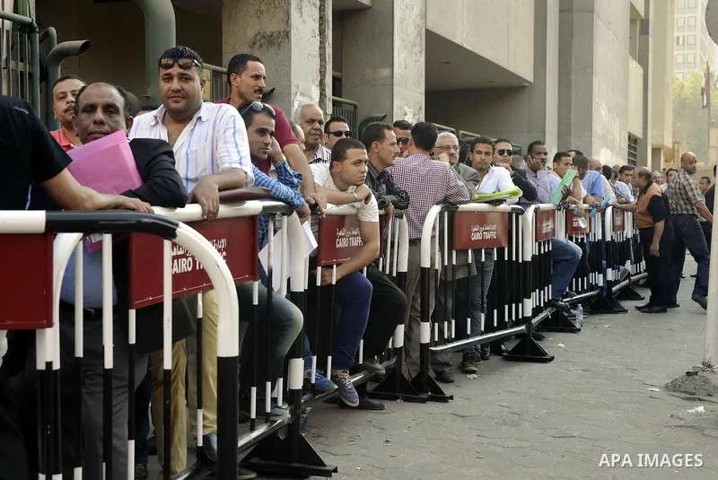Egyptians wait in line to submit nomination paperwork for potential candidates in parliamentary elections, at a courthouse in Cairo, Sept. 1, 2015. Egypt on Sunday announced that long-awaited parliamentary elections will...