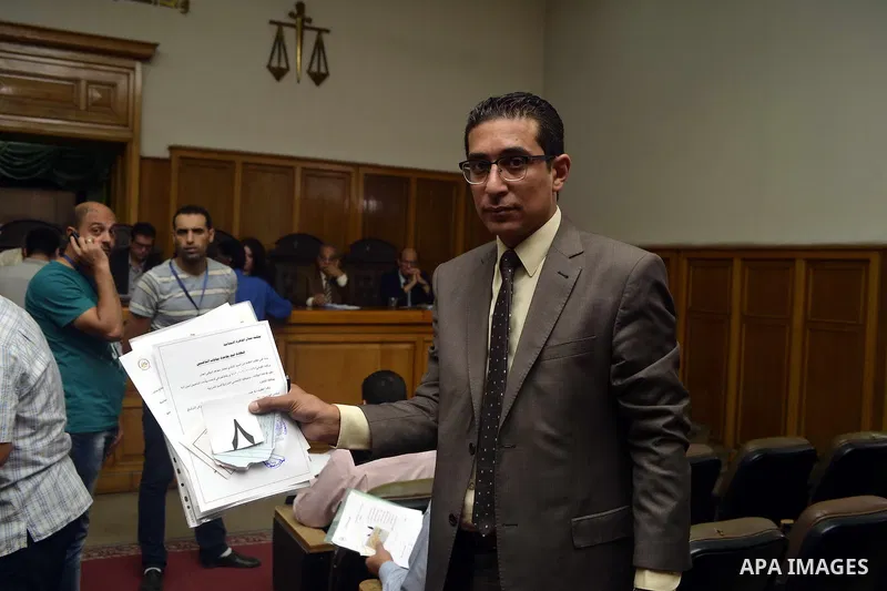 Paperwork for nominations of potential candidates for parliamentary elections is reviewed by authorities, at a courthouse in Cairo, Sept. 1, 2015. Egypt on Sunday announced that long-awaited parliamentary elections will...