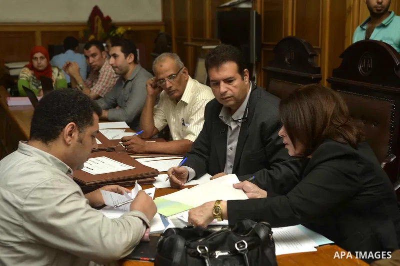 Paperwork for nominations of potential candidates for parliamentary elections is reviewed by authorities, at a courthouse in Cairo, Sept. 1, 2015. Egypt on Sunday announced that long-awaited parliamentary elections will...