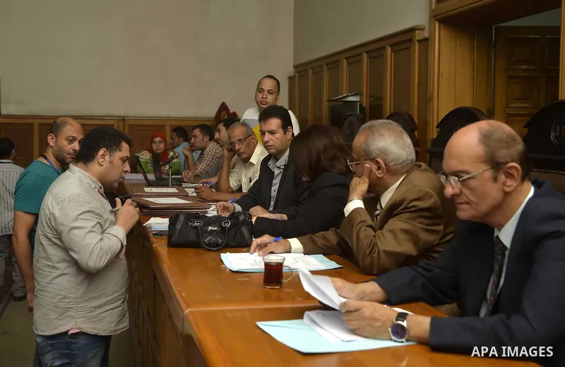Paperwork for nominations of potential candidates for parliamentary elections is reviewed by authorities, at a courthouse in Cairo, Sept. 1, 2015. Egypt on Sunday announced that long-awaited parliamentary elections will...