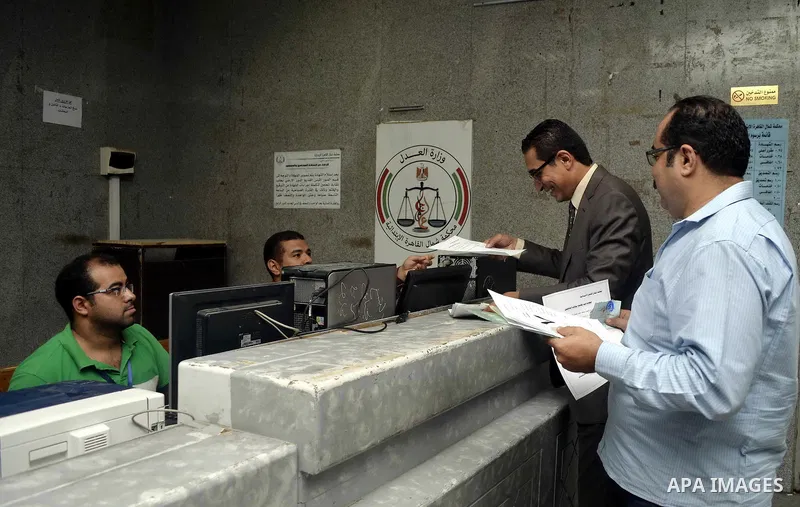 Paperwork for nominations of potential candidates for parliamentary elections is reviewed by authorities, at a courthouse in Cairo, Sept. 1, 2015. Egypt on Sunday announced that long-awaited parliamentary elections will...