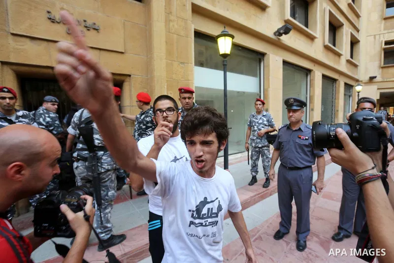 Lebanese activist clash with riot police outside the environment ministry in downtown Beirut on September 1, 2015 as Lebanese police started forcefully evacuating protesters who had occupied part of the building in a sur...