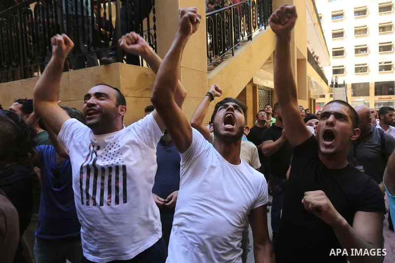 Lebanese activist clash with riot police outside the environment ministry in downtown Beirut on September 1, 2015 as Lebanese police started forcefully evacuating protesters who had occupied part of the building in a sur...