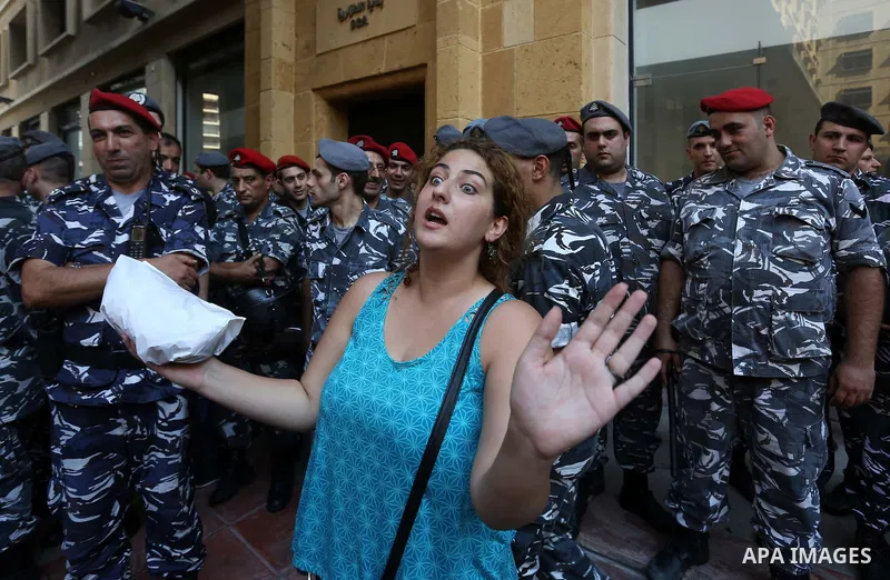 Lebanese activist clash with riot police outside the environment ministry in downtown Beirut on September 1, 2015 as Lebanese police started forcefully evacuating protesters who had occupied part of the building in a sur...