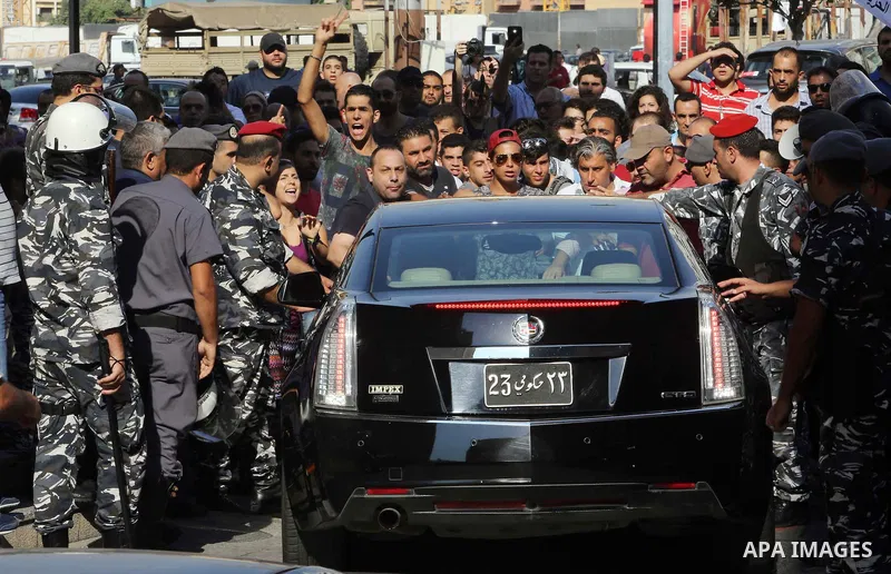 Lebanese activist clash with riot police outside the environment ministry in downtown Beirut on September 1, 2015 as Lebanese police started forcefully evacuating protesters who had occupied part of the building in a sur...