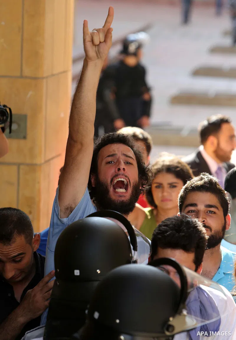 Lebanese activist clash with riot police outside the environment ministry in downtown Beirut on September 1, 2015 as Lebanese police started forcefully evacuating protesters who had occupied part of the building in a sur...