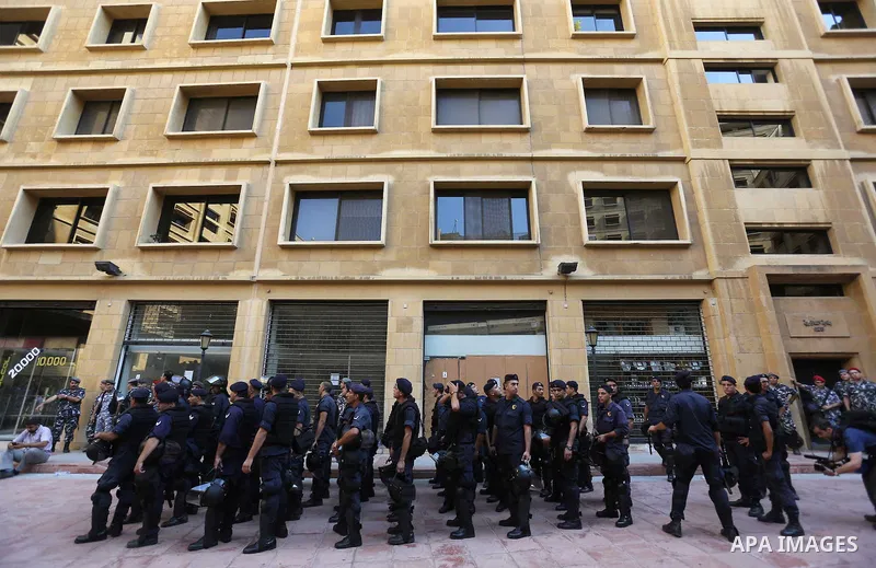 Lebanese activist clash with riot police outside the environment ministry in downtown Beirut on September 1, 2015 as Lebanese police started forcefully evacuating protesters who had occupied part of the building in a sur...