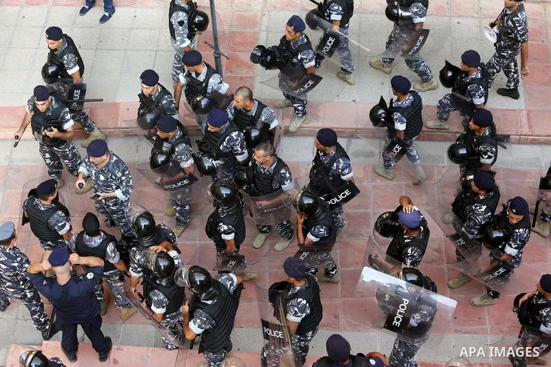 Lebanese activist clash with riot police outside the environment ministry in downtown Beirut on September 1, 2015 as Lebanese police started forcefully evacuating protesters who had occupied part of the building in a sur...