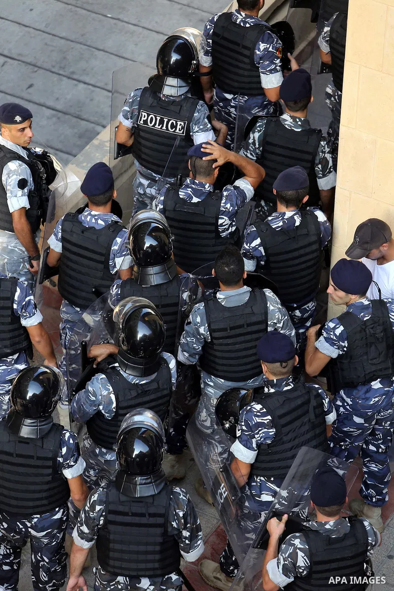 Lebanese activist clash with riot police outside the environment ministry in downtown Beirut on September 1, 2015 as Lebanese police started forcefully evacuating protesters who had occupied part of the building in a sur...