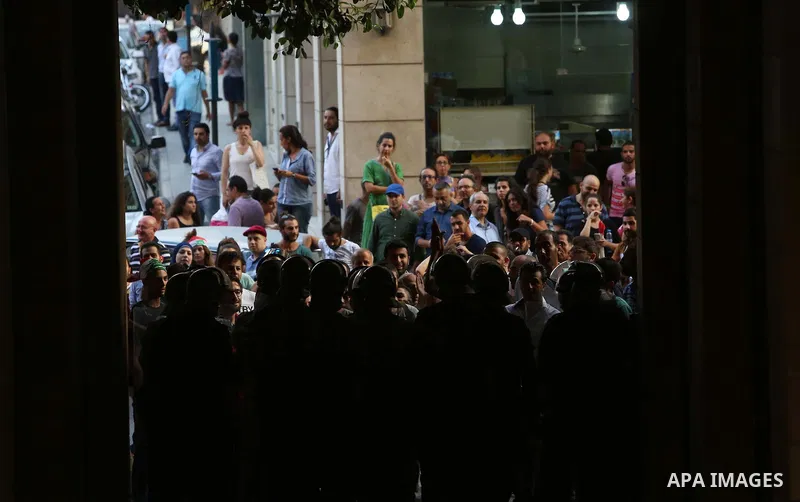 Lebanese activist clash with riot police outside the environment ministry in downtown Beirut on September 1, 2015 as Lebanese police started forcefully evacuating protesters who had occupied part of the building in a sur...