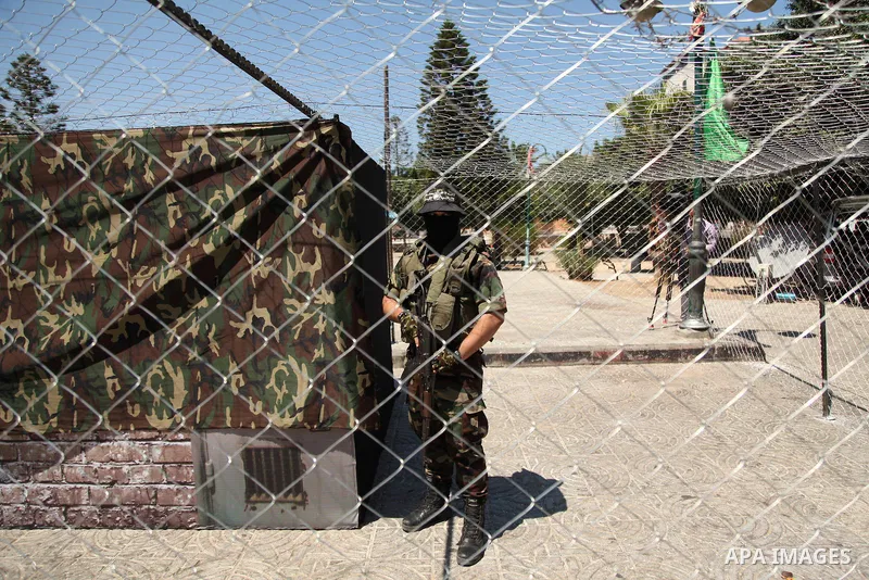 Palestinian militants of the Ezzedine al-Qassam Brigades, Hamas' armed wing, participate in the opening of the exhibition of the al-Qassam mock prisons, in Gaza city, on Sep. 02, 2015. Photo by Ashraf Amra