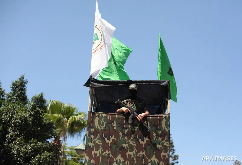 Palestinian militants of the Ezzedine al-Qassam Brigades, Hamas' armed wing, participate in the opening of the exhibition of the al-Qassam mock prisons, in Gaza city, on Sep. 02, 2015. Photo by Ashraf Amra