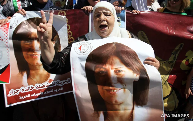 Palestinian protesters hold posters during a protest to show soldarity with prisoners, in the West Bank city of Nablus, on Sep. 03, 2015. Photo by Nedal Eshtayah