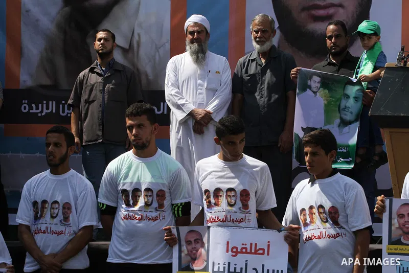 Families of Palestinians who were abducted of by gunmen is Egypt's Sinai's northern region, take part in a demonstration calling for their release outside the Egyptian embassy in Gaza city, on Sep. 4, 2015. Gunmen in Egy...