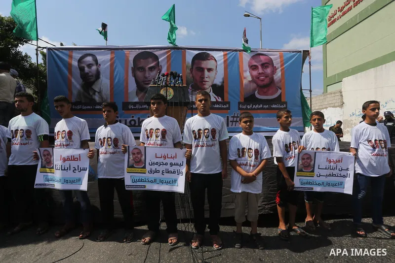 Families of Palestinians who were abducted of by gunmen is Egypt's Sinai's northern region, take part in a demonstration calling for their release outside the Egyptian embassy in Gaza city, on Sep. 4, 2015. Gunmen in Egy...